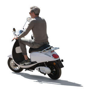 backlit man riding a white motor scooter