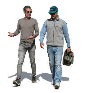 two men walking in the street and talking