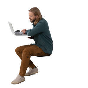 man sitting behind a computer