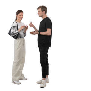 woman and man standing and eating cherries