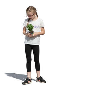 cut out little girl with a plant standing in the garden