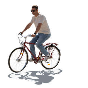 cut out backlit man riding a bicycle