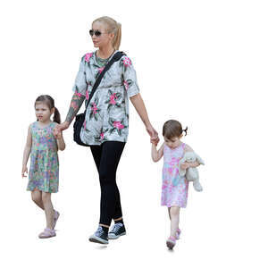 woman walking hand in hands with two kids 