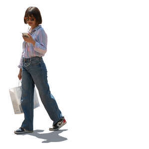 cut out backlit woman with a shopping bag and listening to music