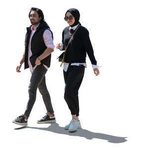 cut out backlit middle eastern man and woman walking