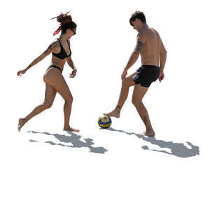 two people playing football on the beach