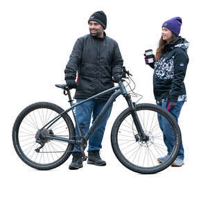 cut out man and woman standing with a bike in autumn