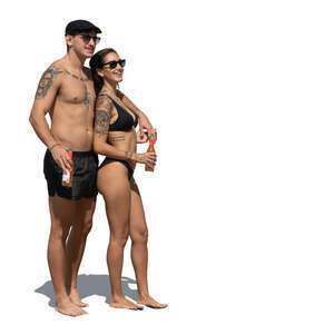 couple standing on the beach and drinking soda drinks