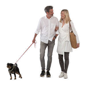 cut out happy middle aged couple walking a dog