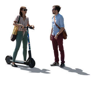 cut out backlit woman on an electric scooter talking to a man