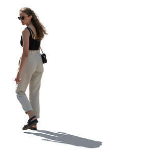 cut out backlit woman walking