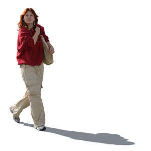 backlit teenage girl walking