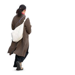 cut out woman wearing a brown overcoat walking