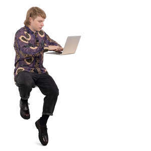 young man sitting at a counter height table and working