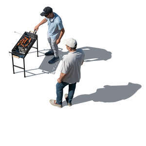 top view of two men grilling meat