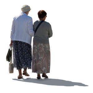 two cut out backlit older ladies walking