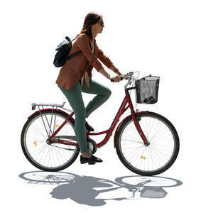 cut out backlit woman riding a bike