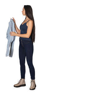 woman standing and putting her pullover in the closet