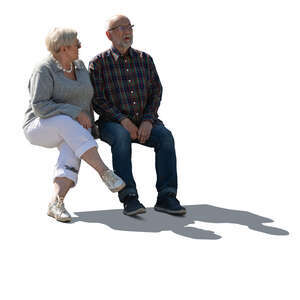 cut out backlit elderly couple sitting