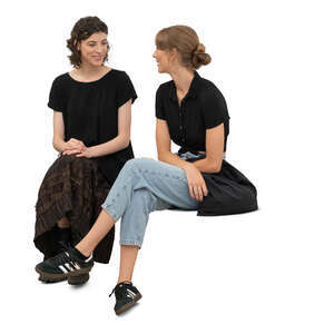 two cut out women sitting and talking casually