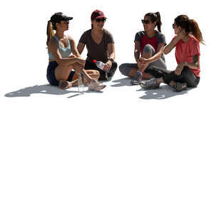 group of women in sport outfits sitting in a circle