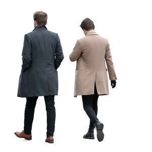 two men wearing overcoats walking