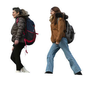 two cut out women walking seen from below