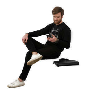 cut out man sitting and texting