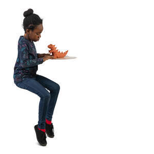 black girl sitting and doing ceramics