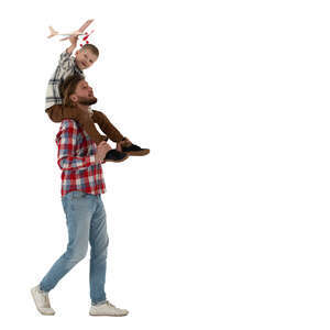 boy sitting on his fathers shoulders and flying a toy plane