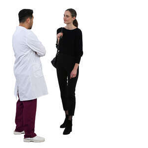 woman standing talking to a doctor