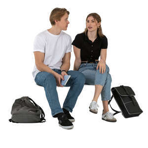 two young people sitting and discussing