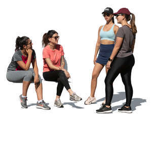 women resting and talking after workout