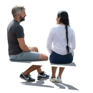 backlit man and woman sitting