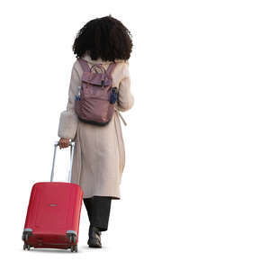 woman pulling a red suitcase walking