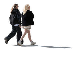 two young backlit women walking