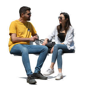 two middle eastern people sitting and talking