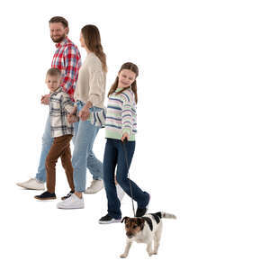 family with a dog walking hand in hand