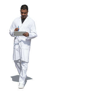 cut out indian doctor walking and holding a tablet