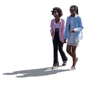 two backlit black women walking