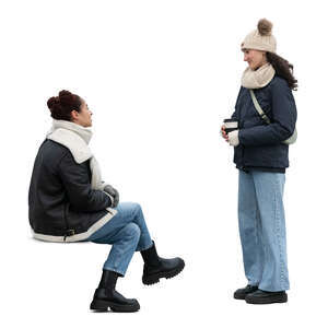 two cut out women in winter talking