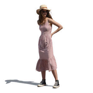 cut out woman in a summer dress and wearing a hat standing