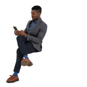 cut out man sitting and texting