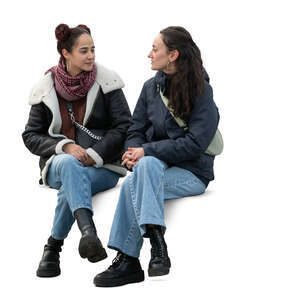 two women sitting in spring and talking