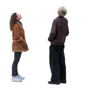 two people standing and looking up