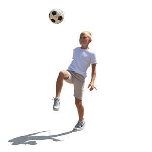cut out backlit little boy playing with a football