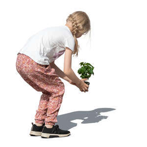 cut out girl planting a flower in the garden