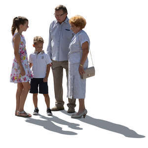 backlit grandparents and grandchildren standing