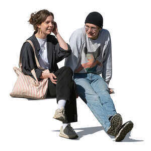 two young people sitting and talking