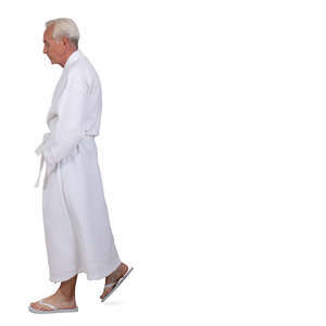 cut out grey haired man in a white bathrobe walking